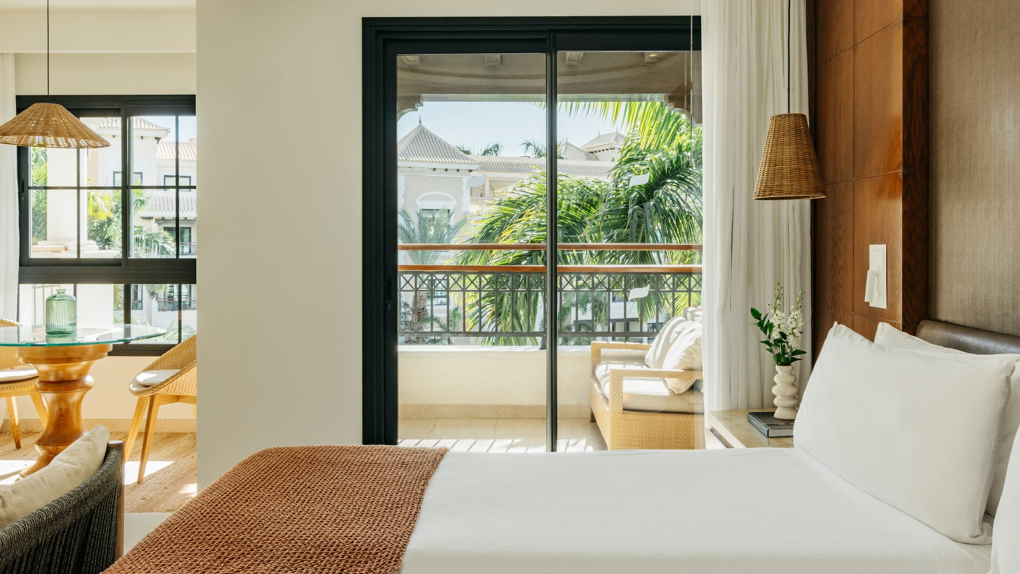 a bed with a brown blanket and a brown lamp