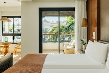 a bed with a brown blanket and a brown lamp