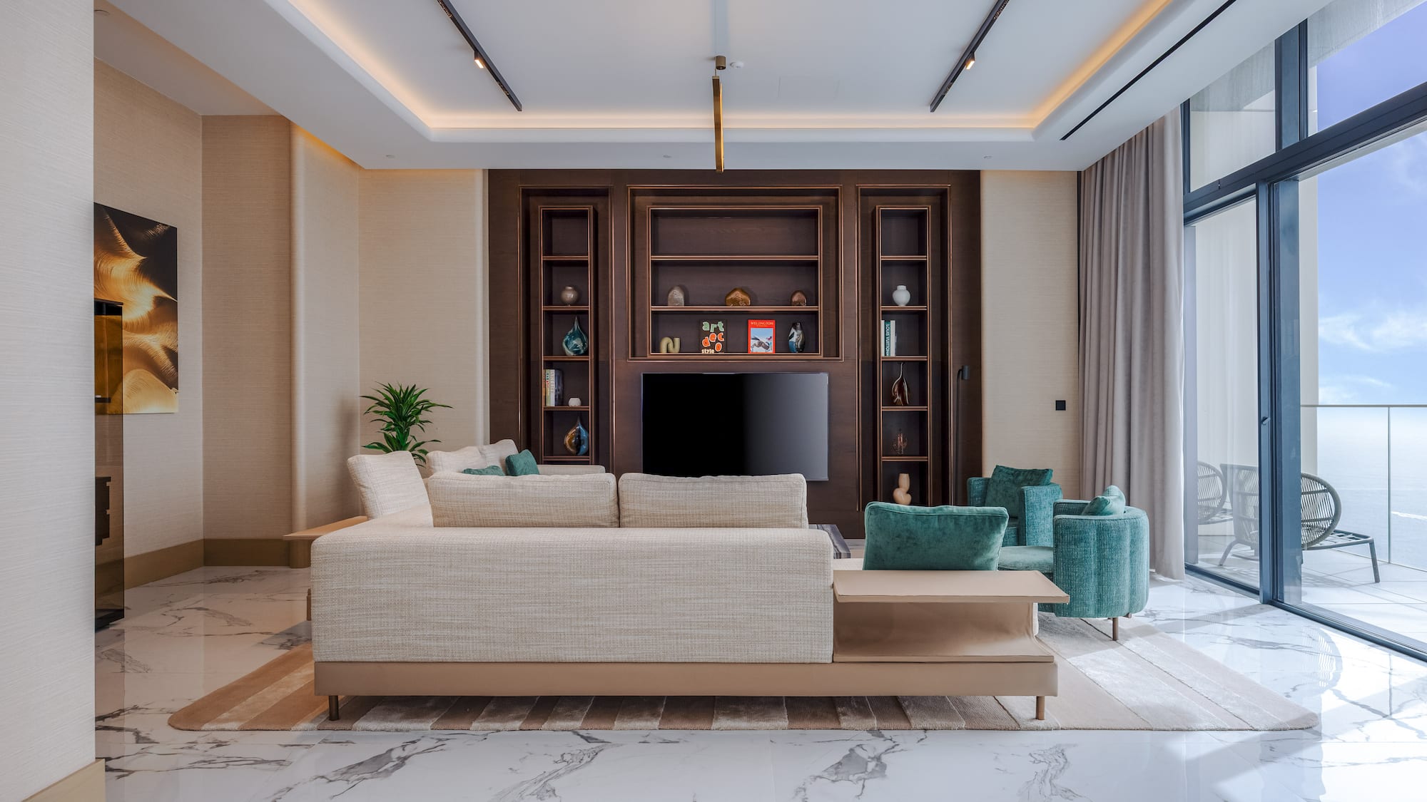 Modern living room, light sofa, dark wood media, marble floor, ocean view.