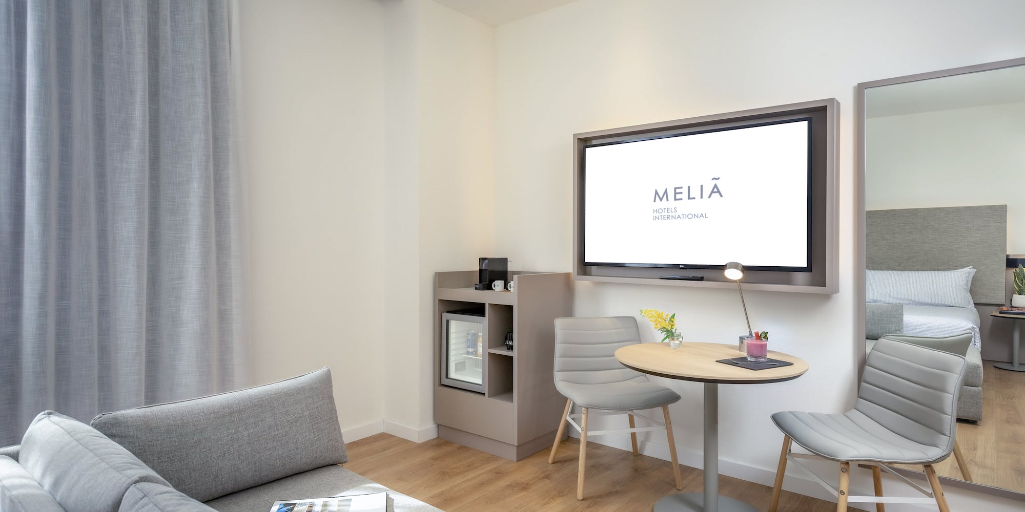 a living room with a tv and a table