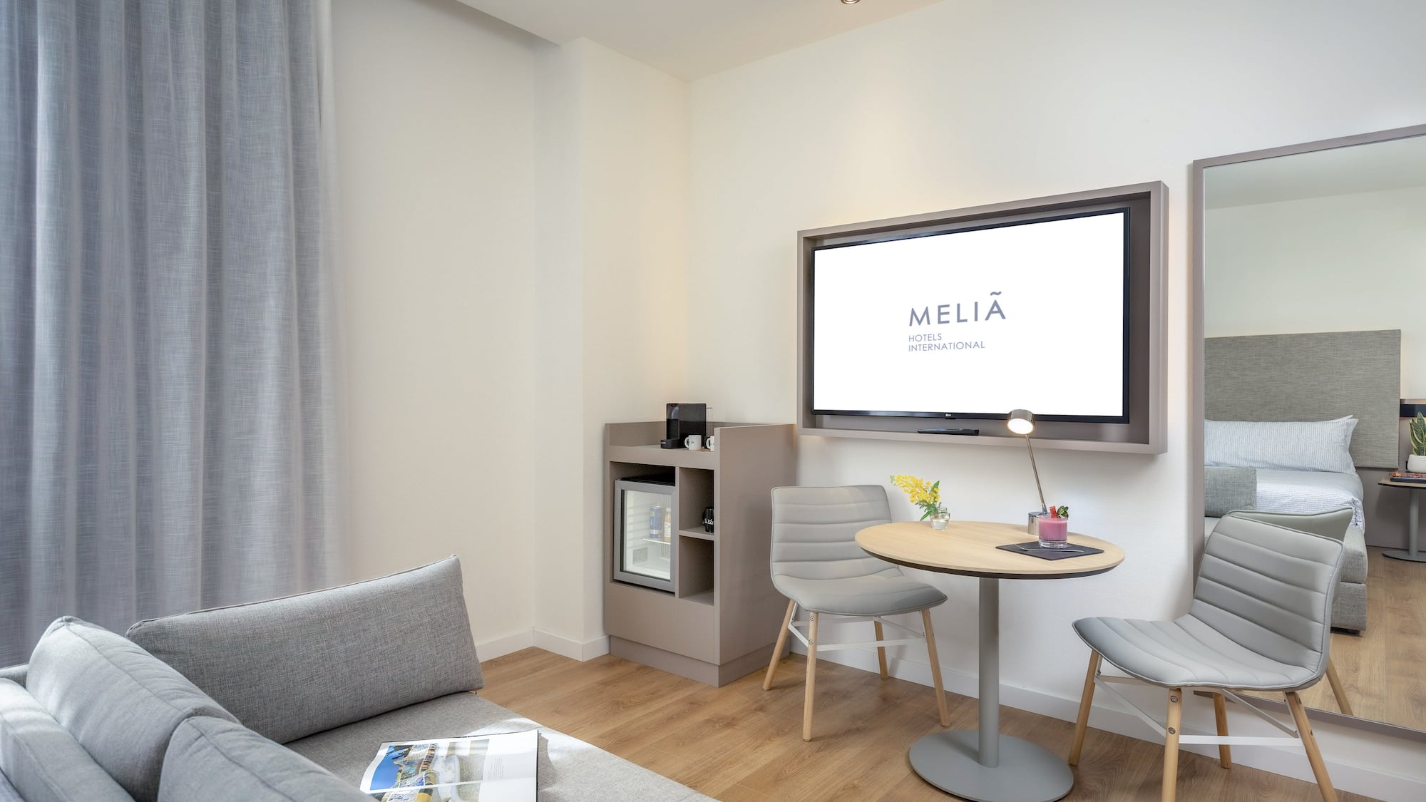 a living room with a tv and a table