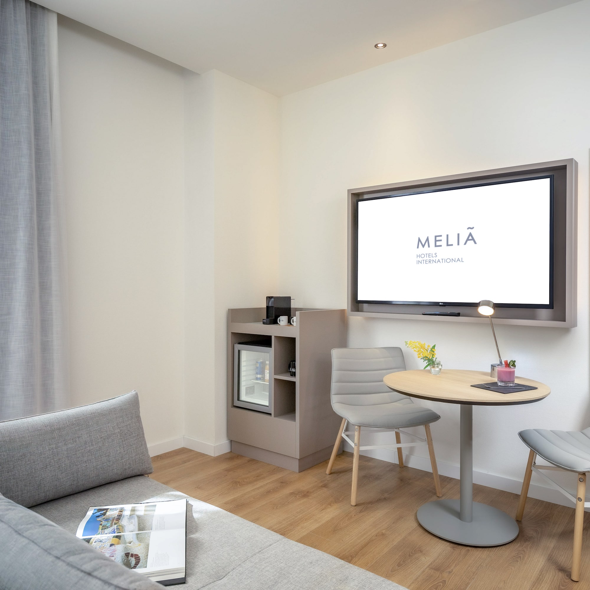 a living room with a tv and a table