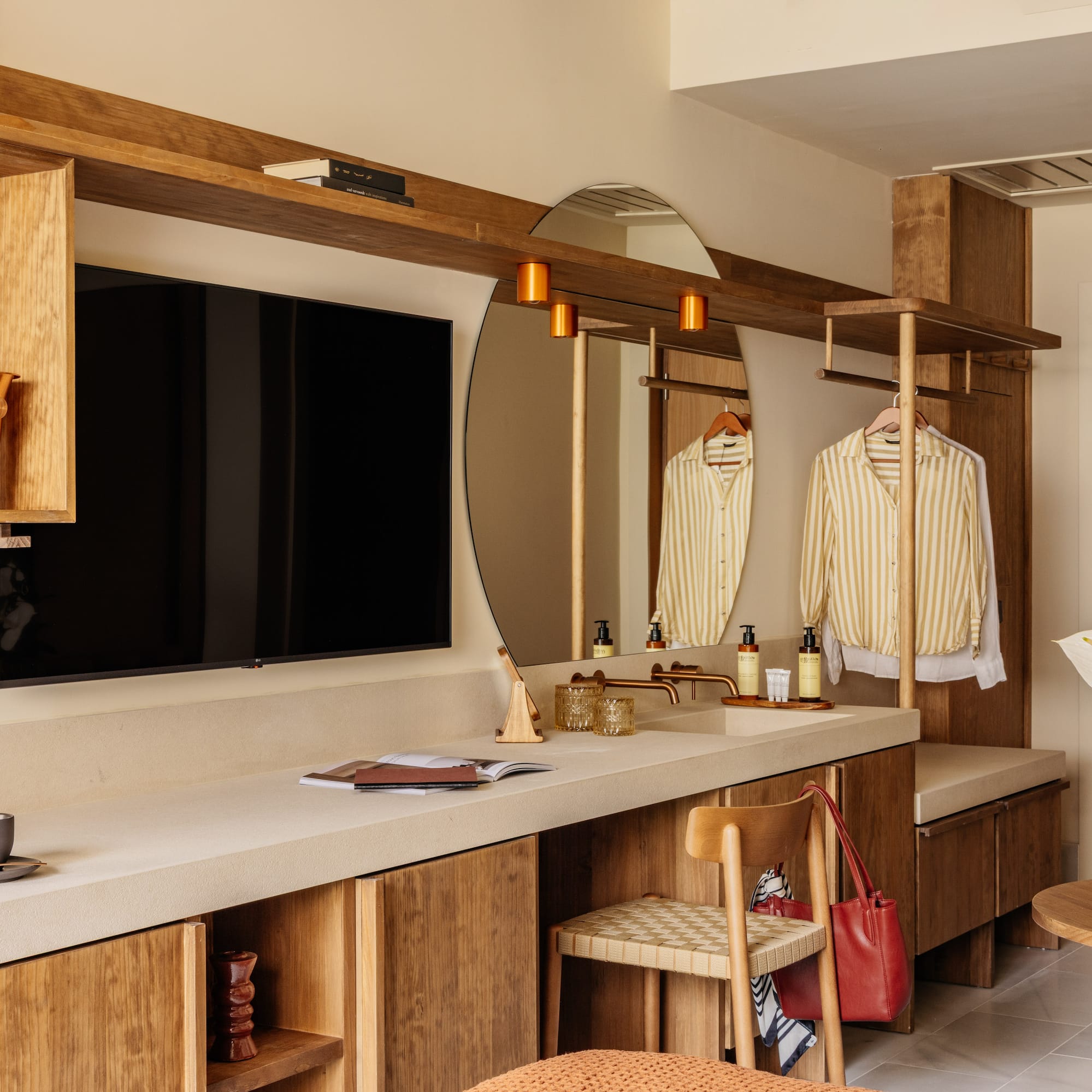 a room with a mirror and a television