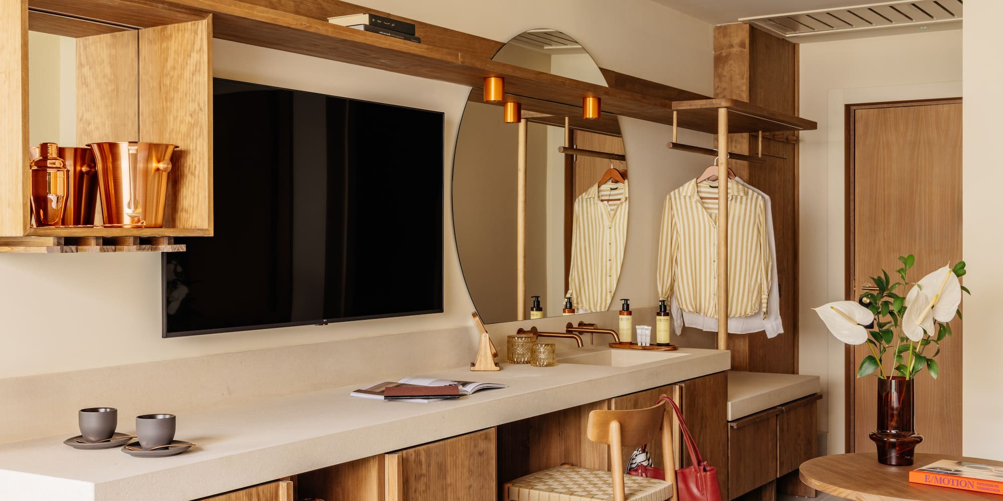 a room with a mirror and a television