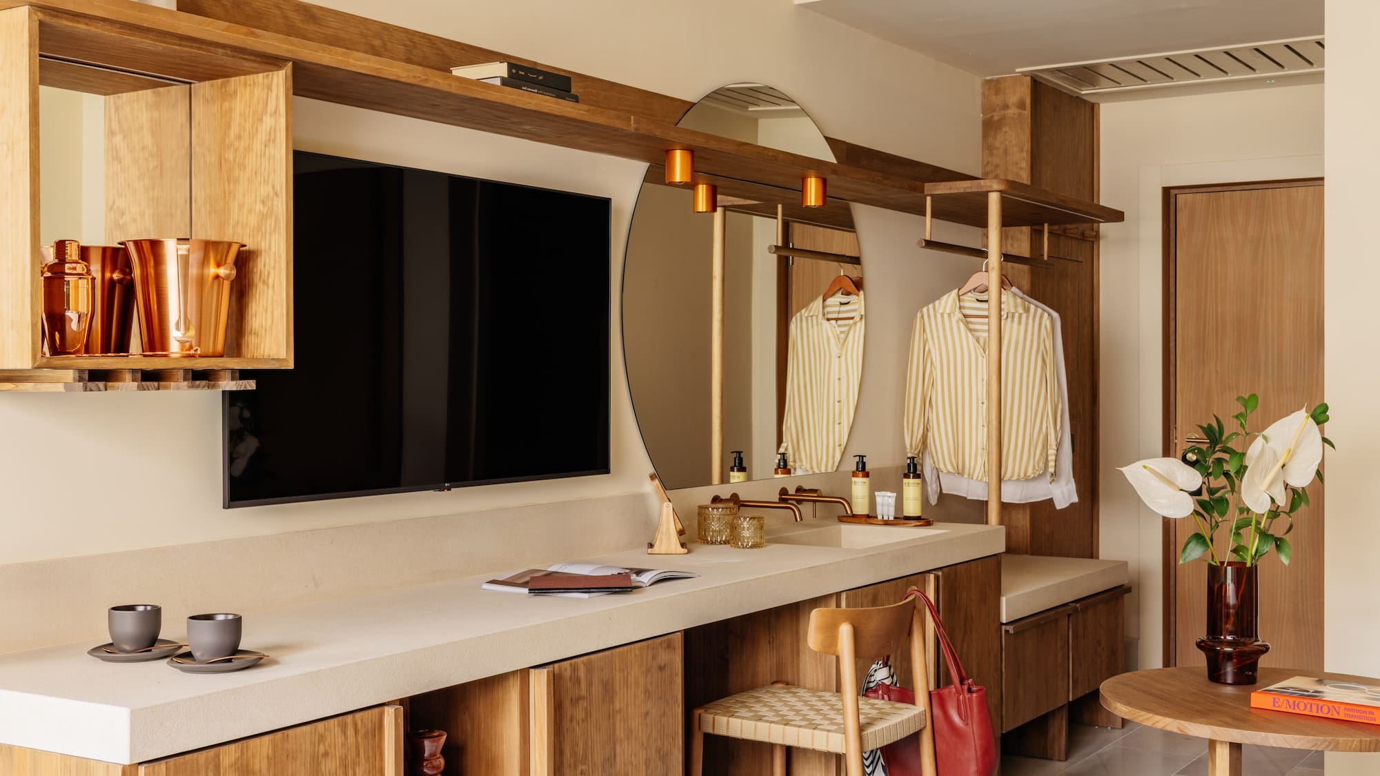 a room with a mirror and a television