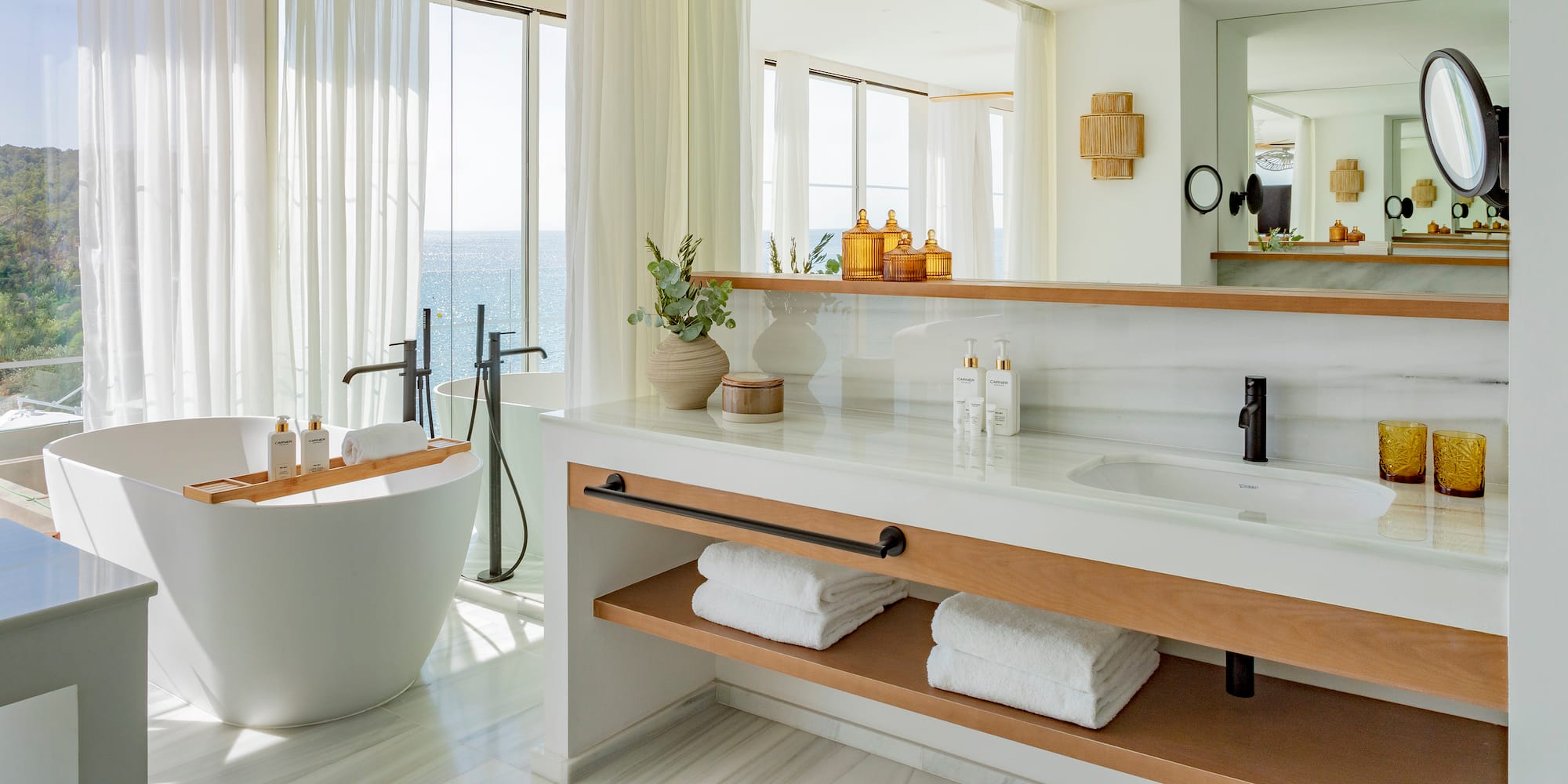 a bathroom with a tub and a bathtub