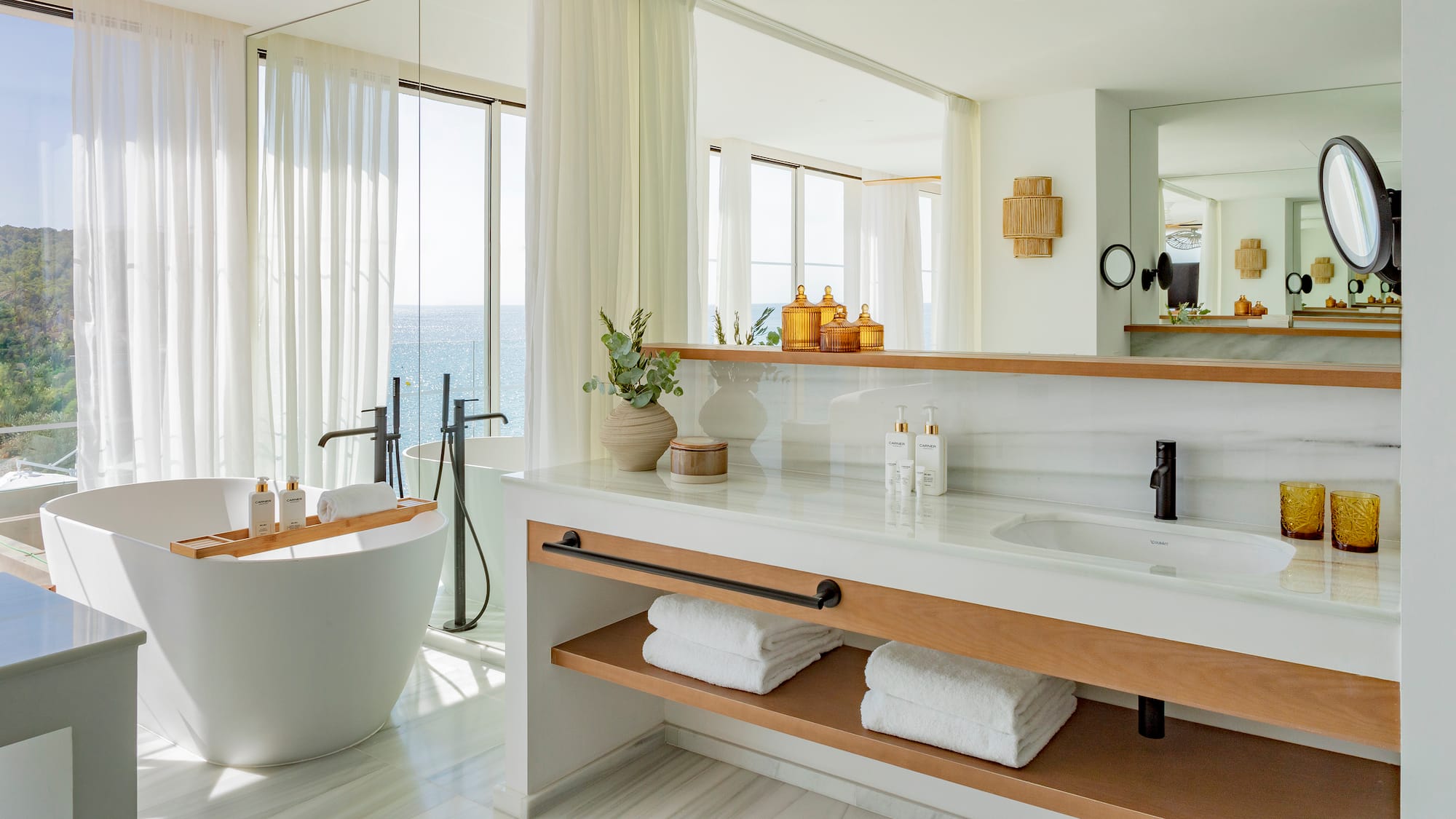 a bathroom with a tub and a bathtub