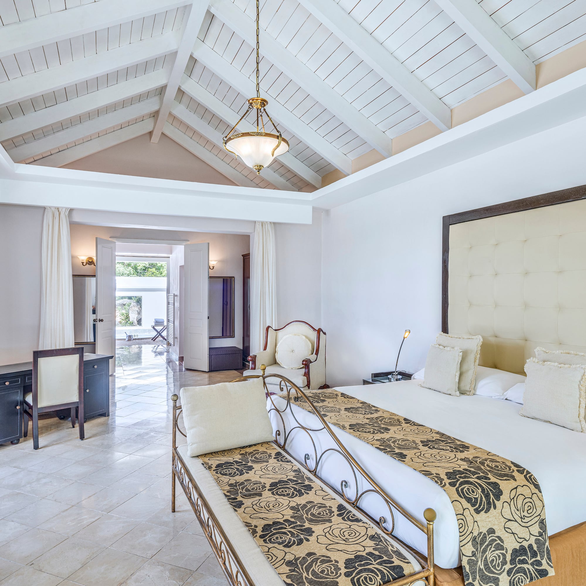 a bedroom with a bed and a table