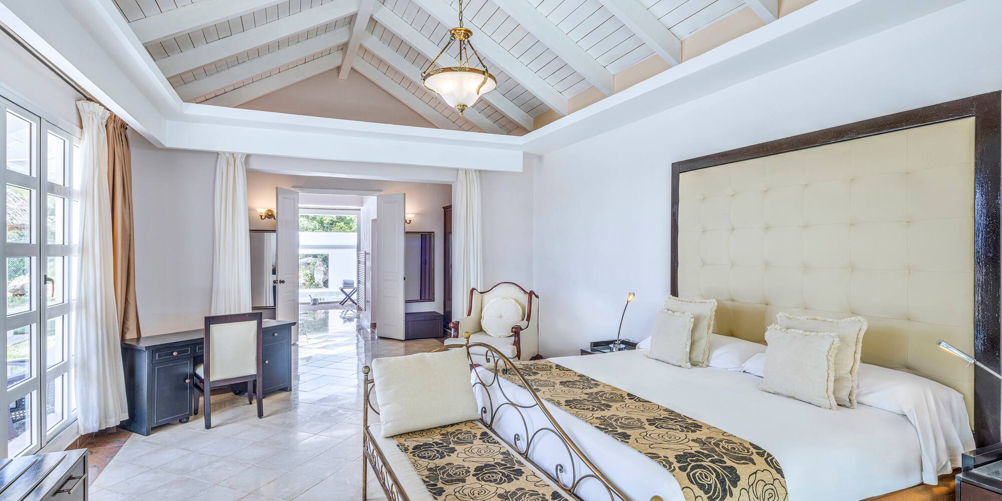 a bedroom with a bed and a table