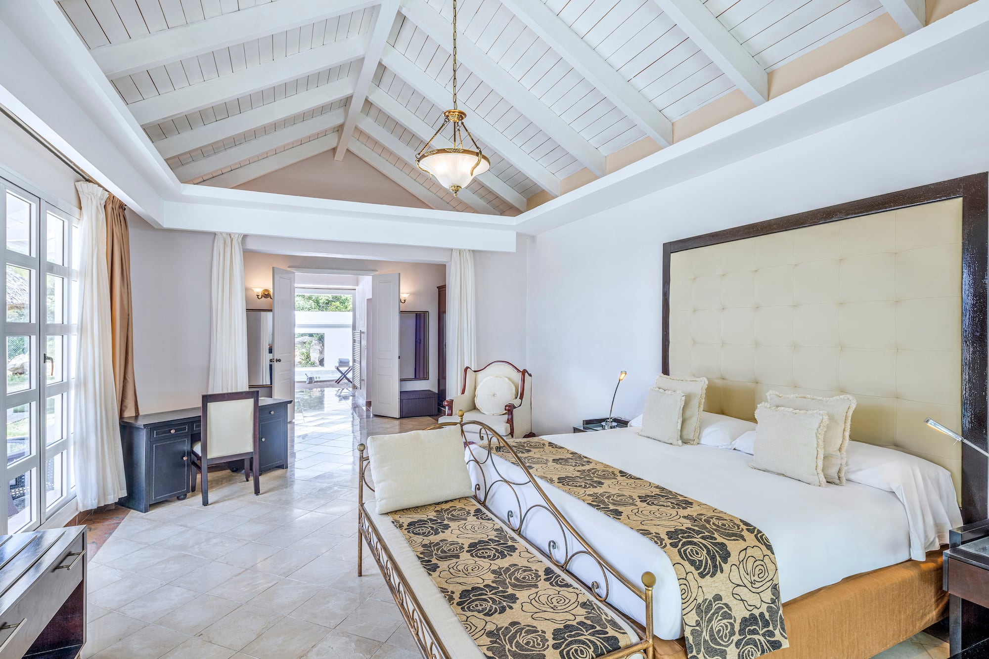 a bedroom with a bed and a table