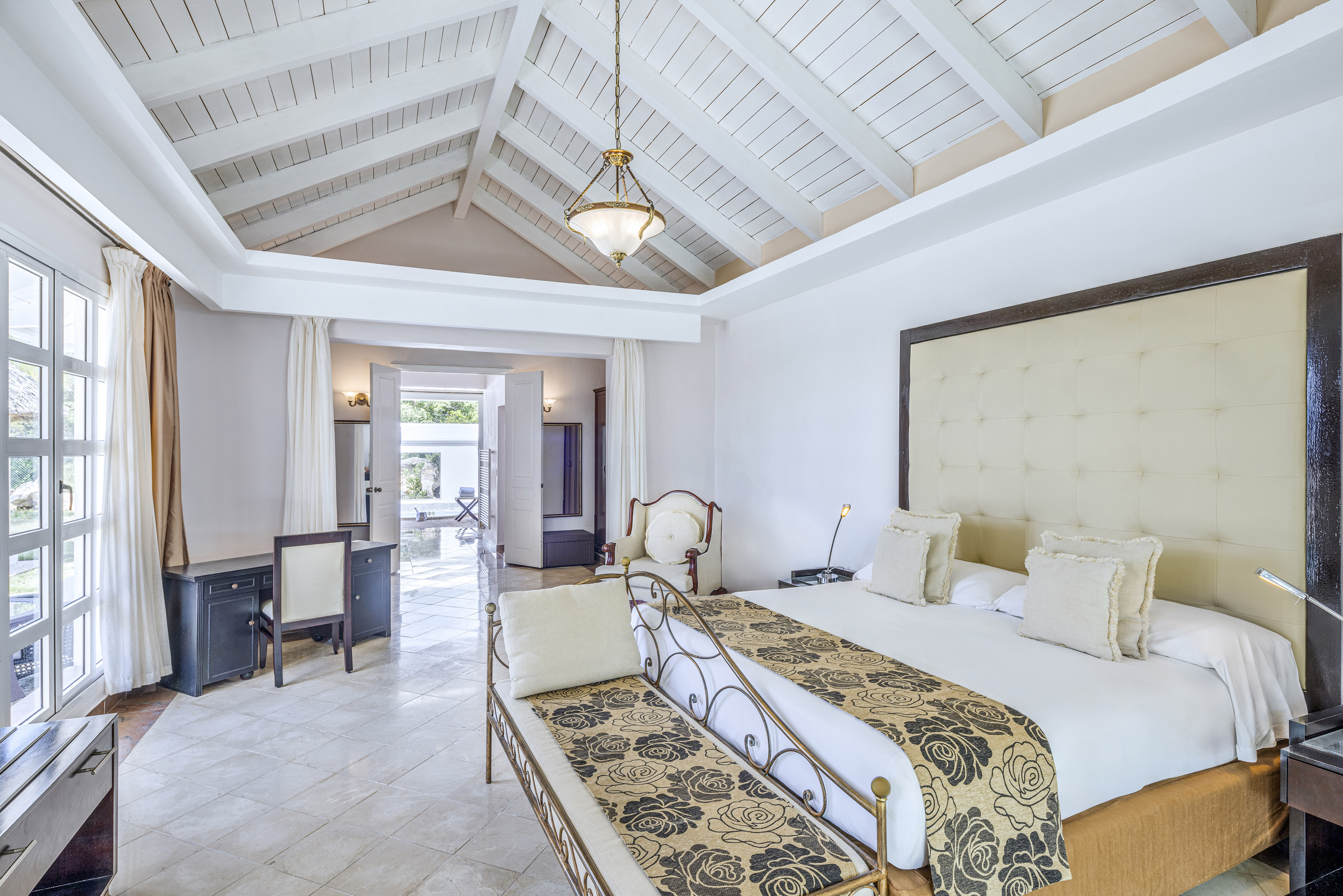 a bedroom with a bed and a table