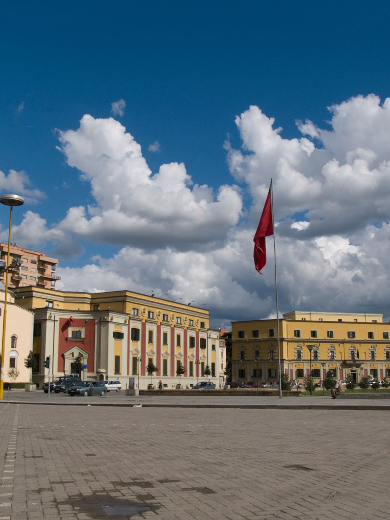 a building with a flag on the pole