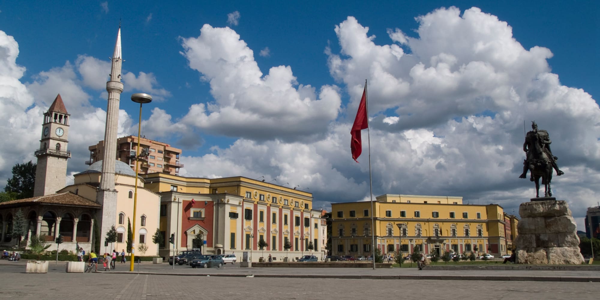 a building with a flag on the pole