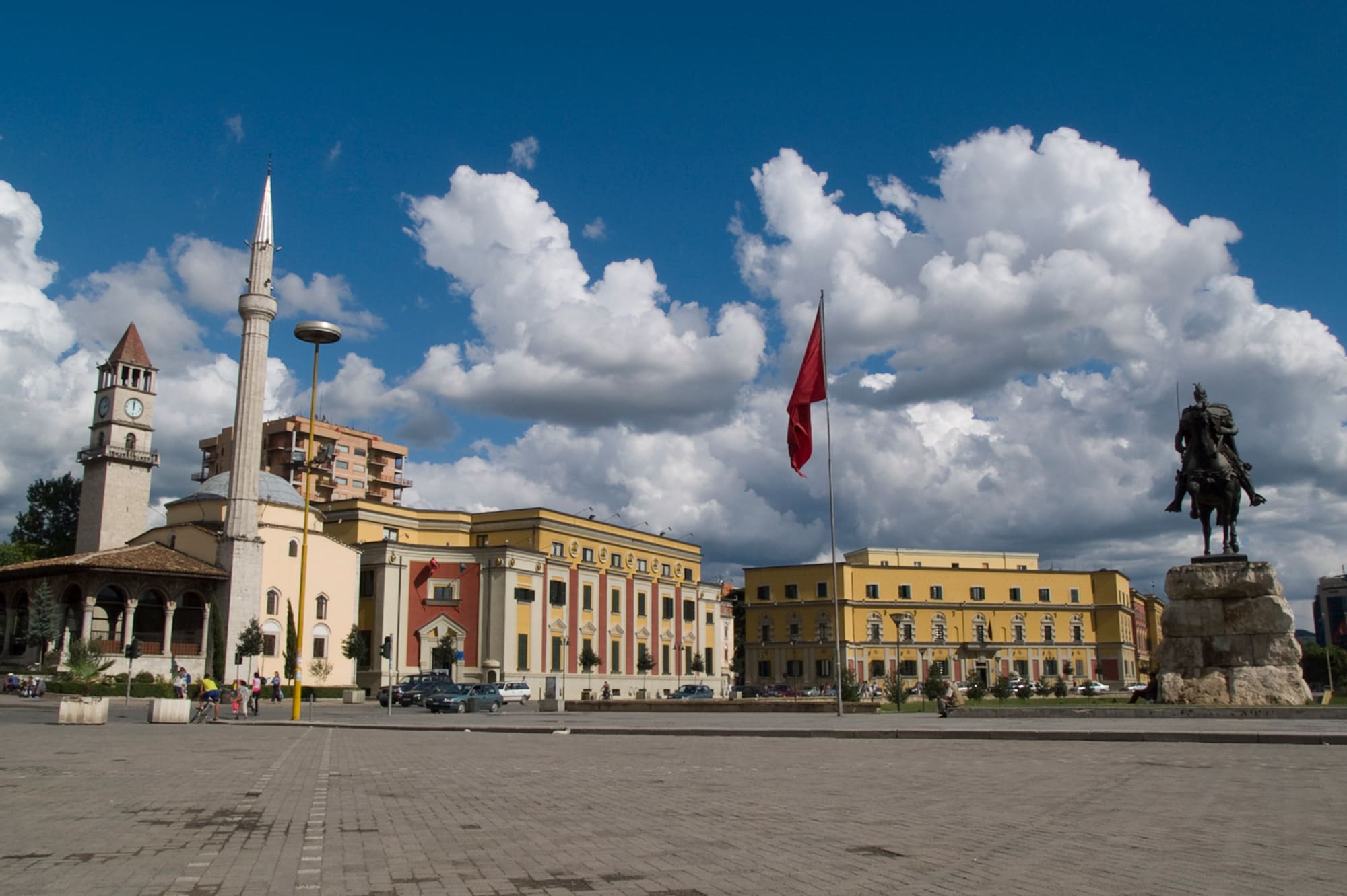 a building with a flag on the pole