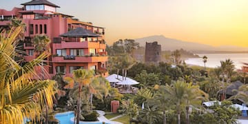 a building with a pool and trees