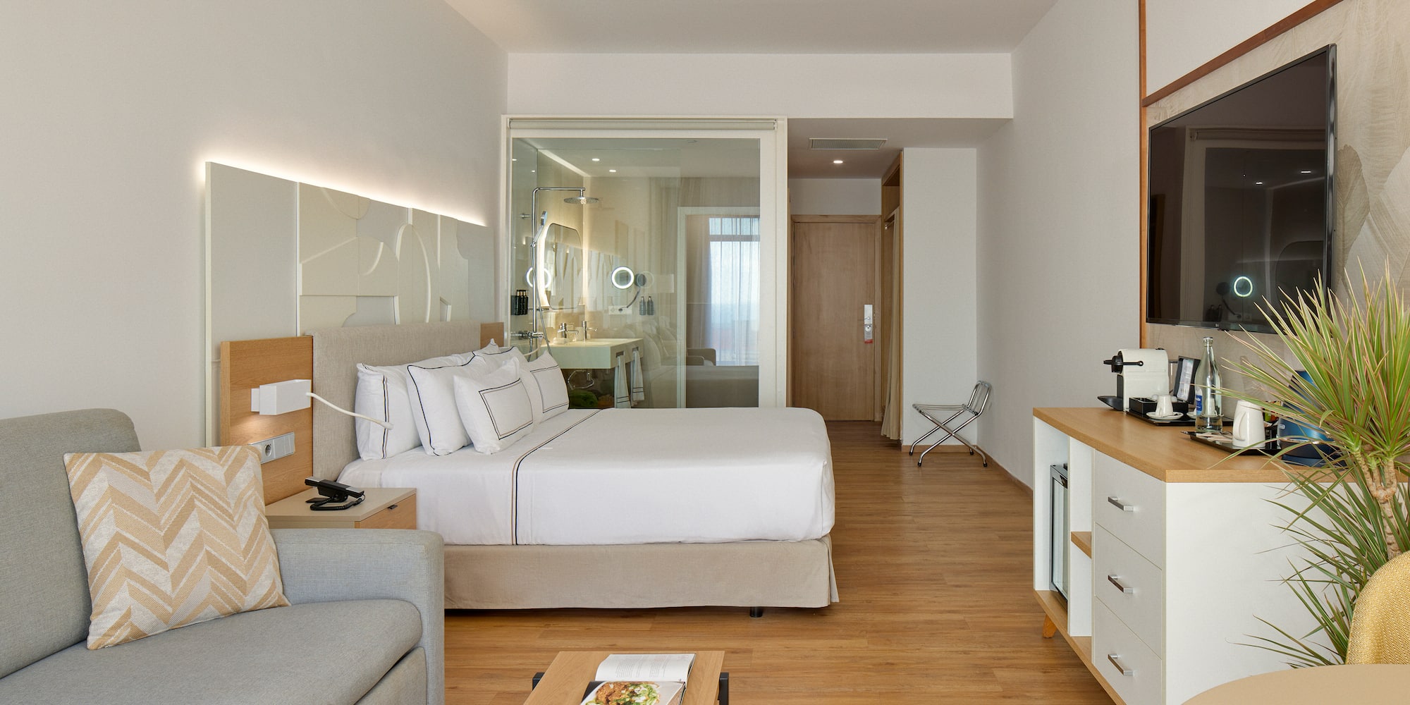 a bedroom with a bed and a couch