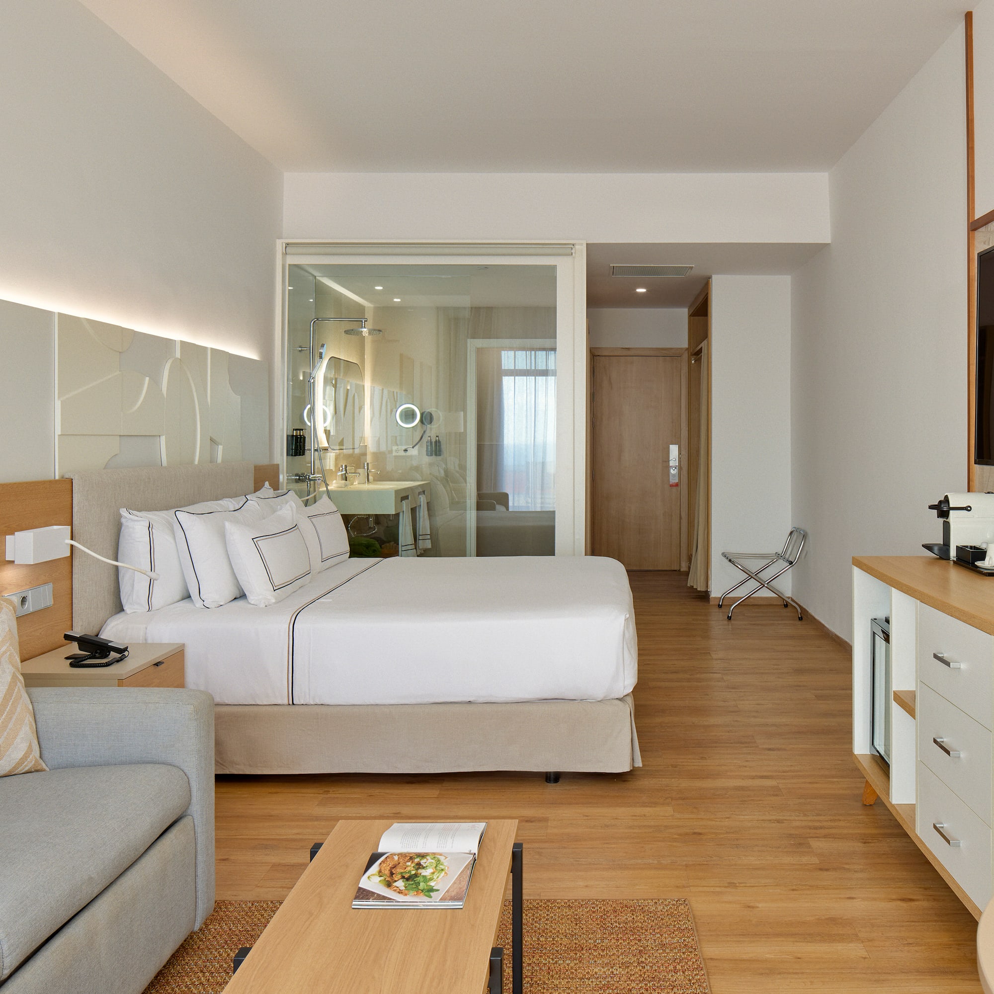 a bedroom with a bed and a couch