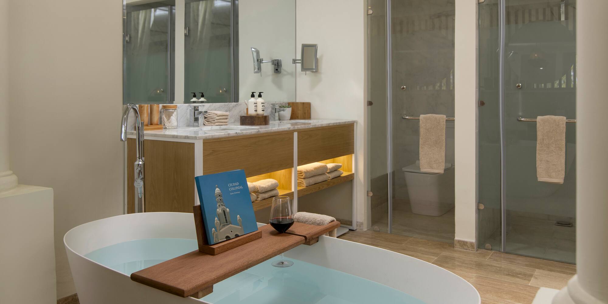 a bathroom with a tub and a glass shower