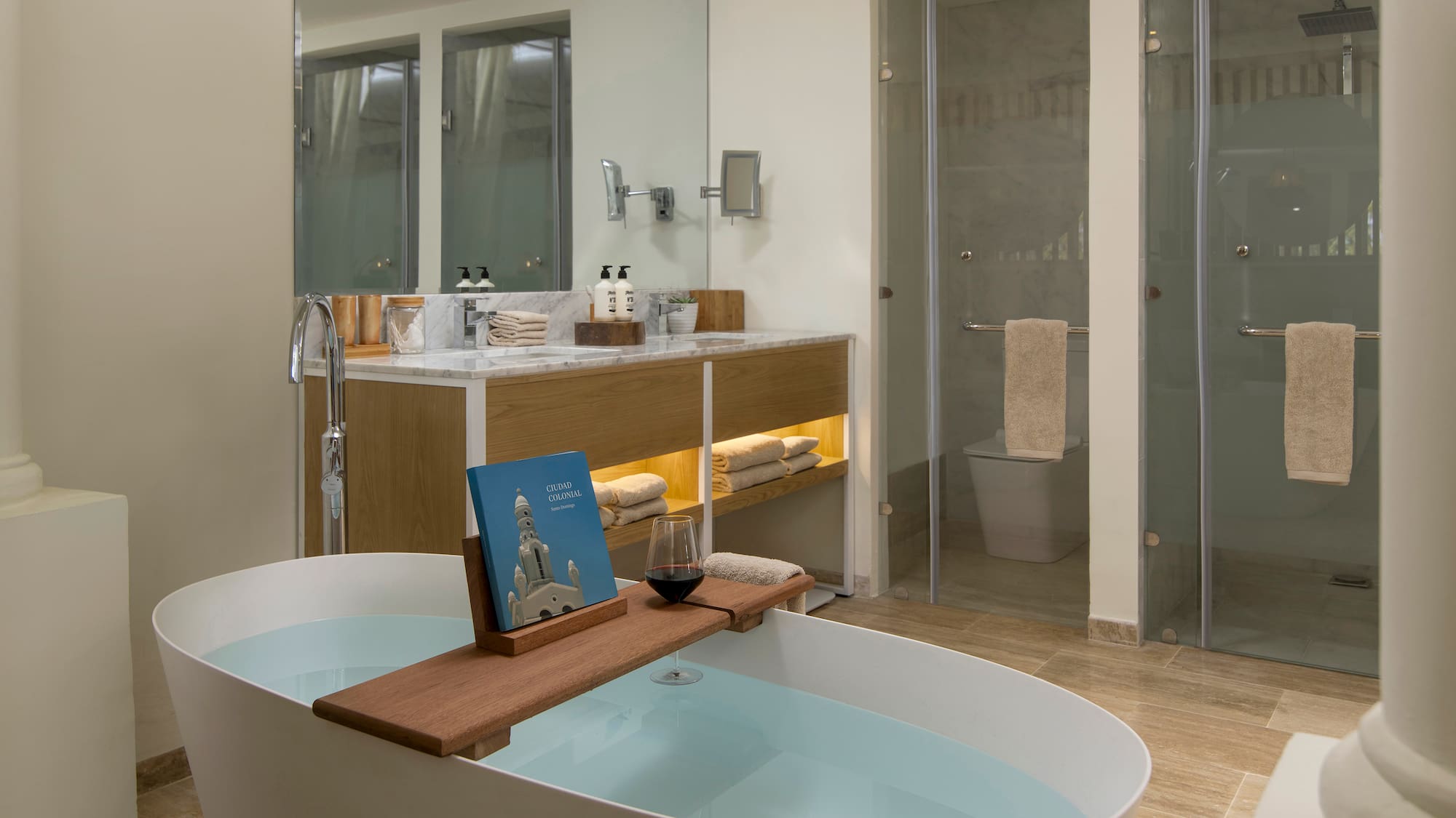 a bathroom with a tub and a glass shower