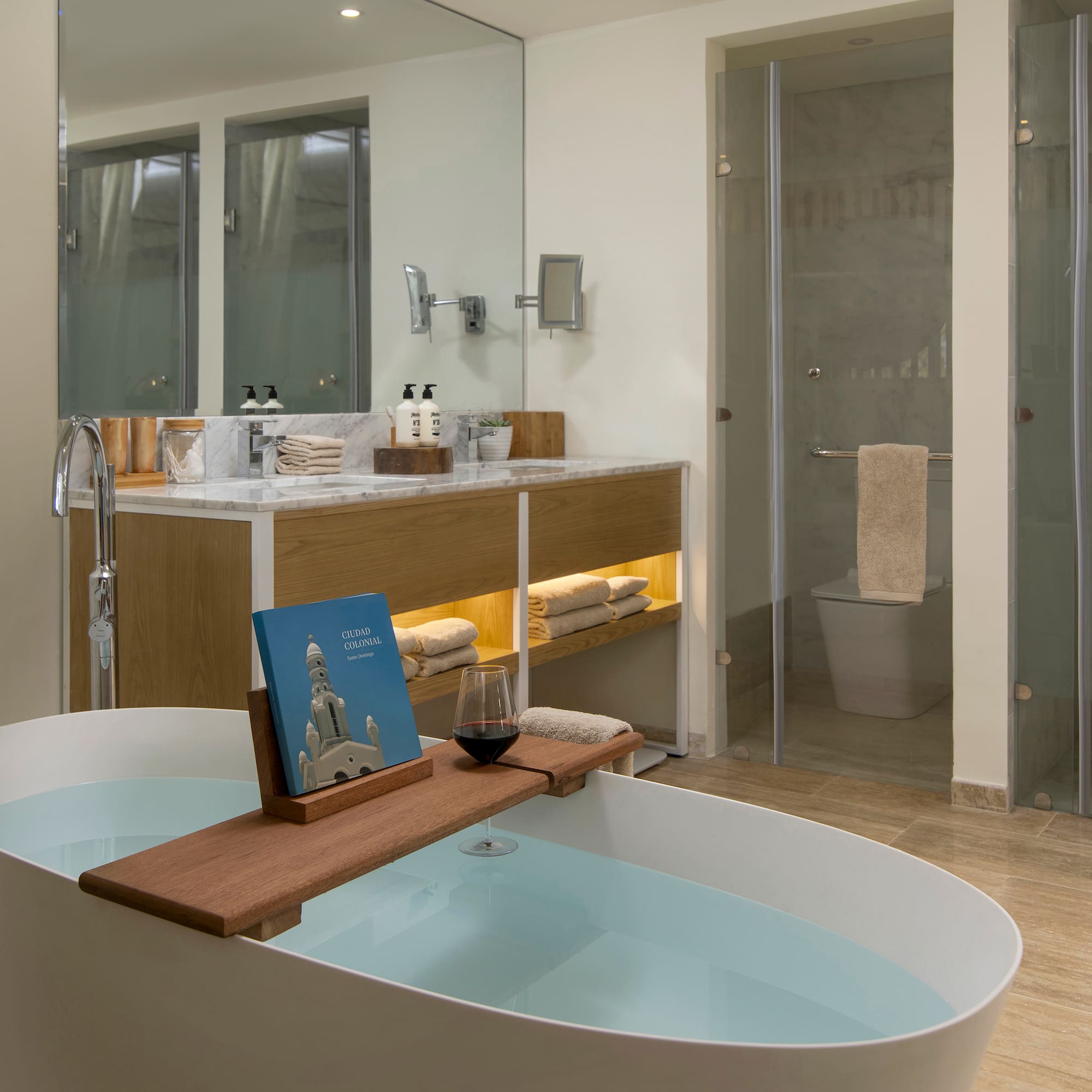 a bathroom with a tub and a glass shower
