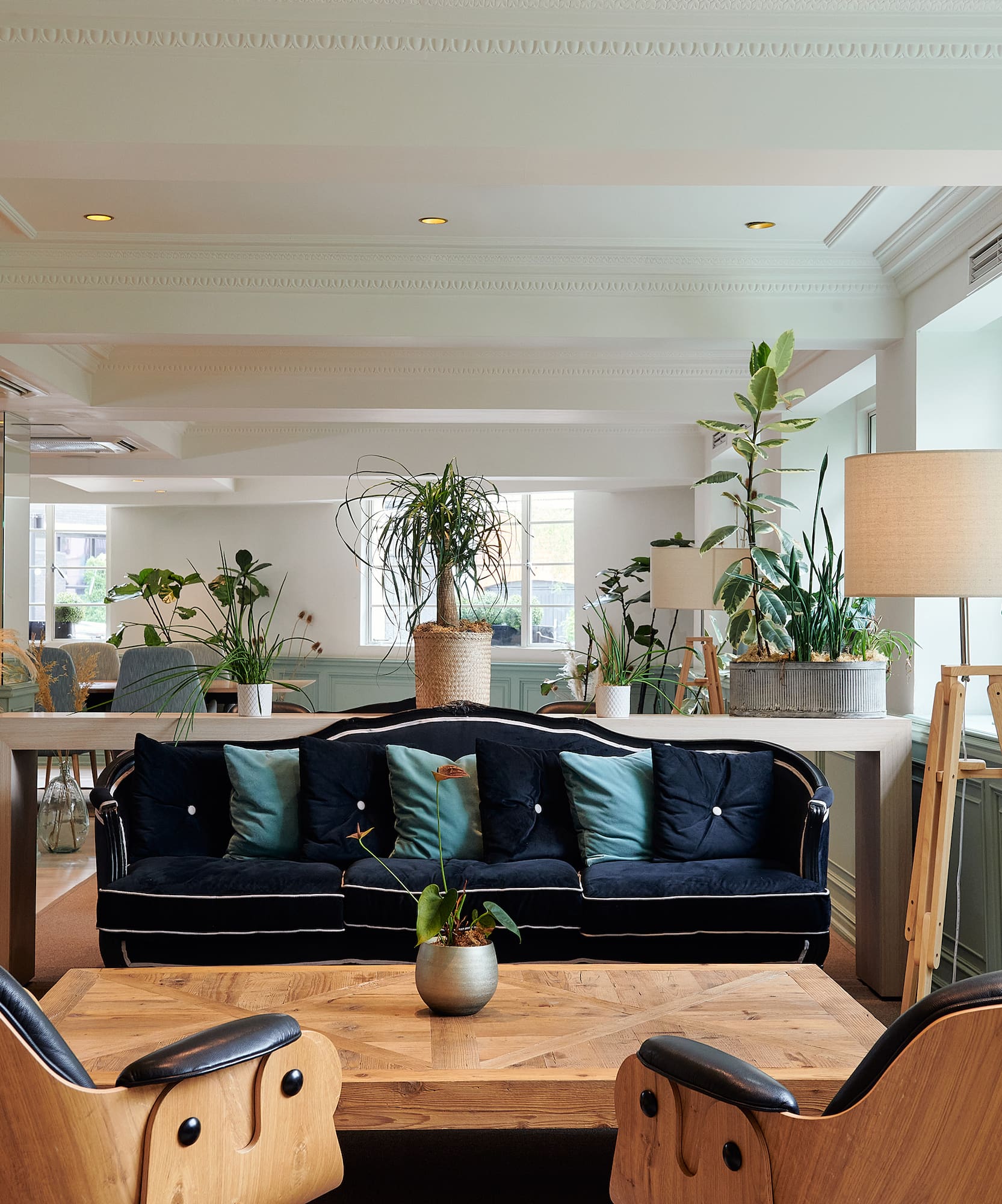 a room with a couch and chairs