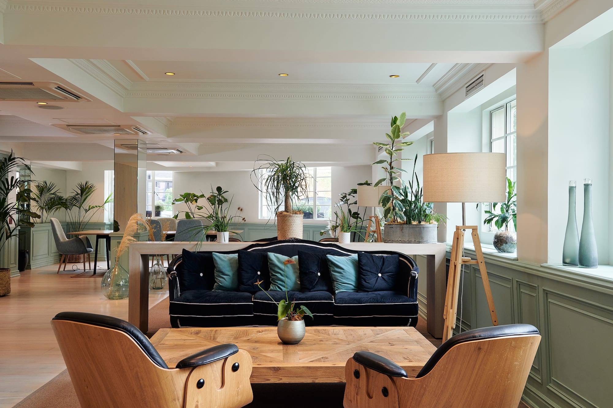 a room with a couch and chairs