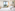 Bright hotel room with city view, white bed, green armchair, and modern decor.