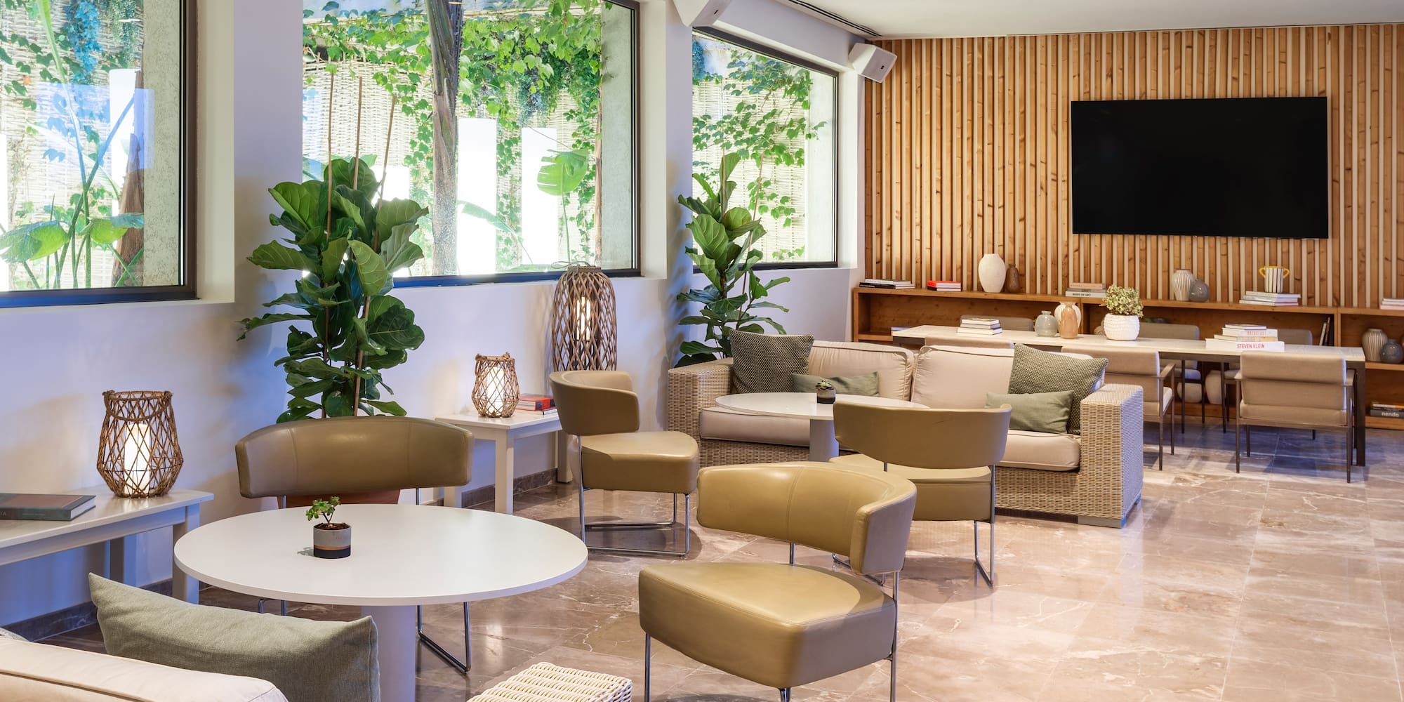 a room with a television and chairs