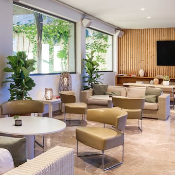 a room with a television and chairs