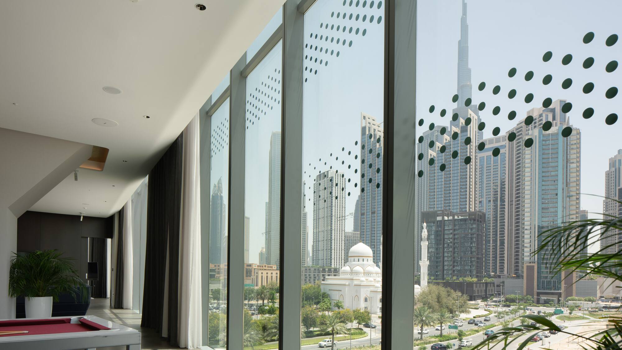 a large window with a view of a city