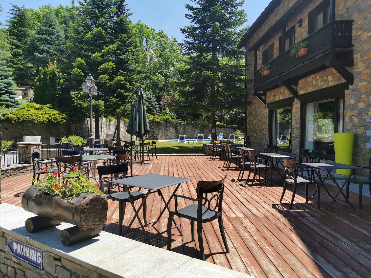 a patio with tables and chairs