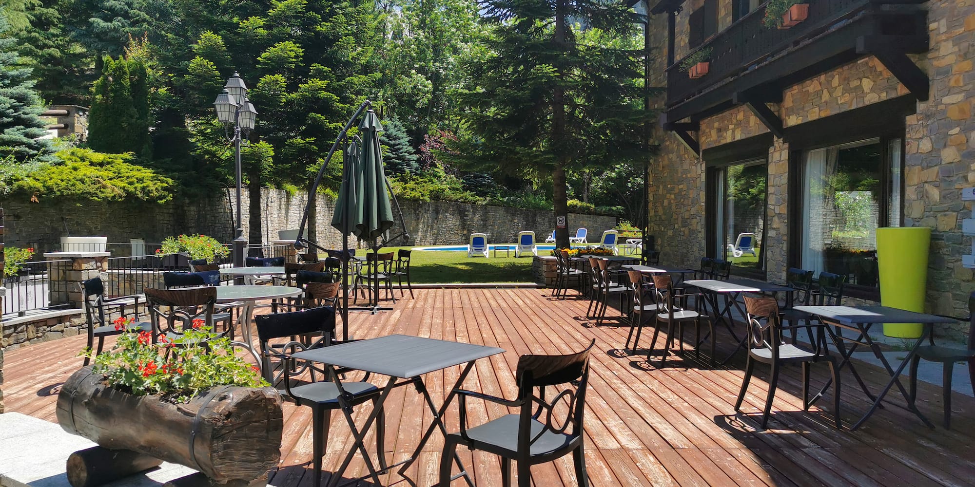 a patio with tables and chairs