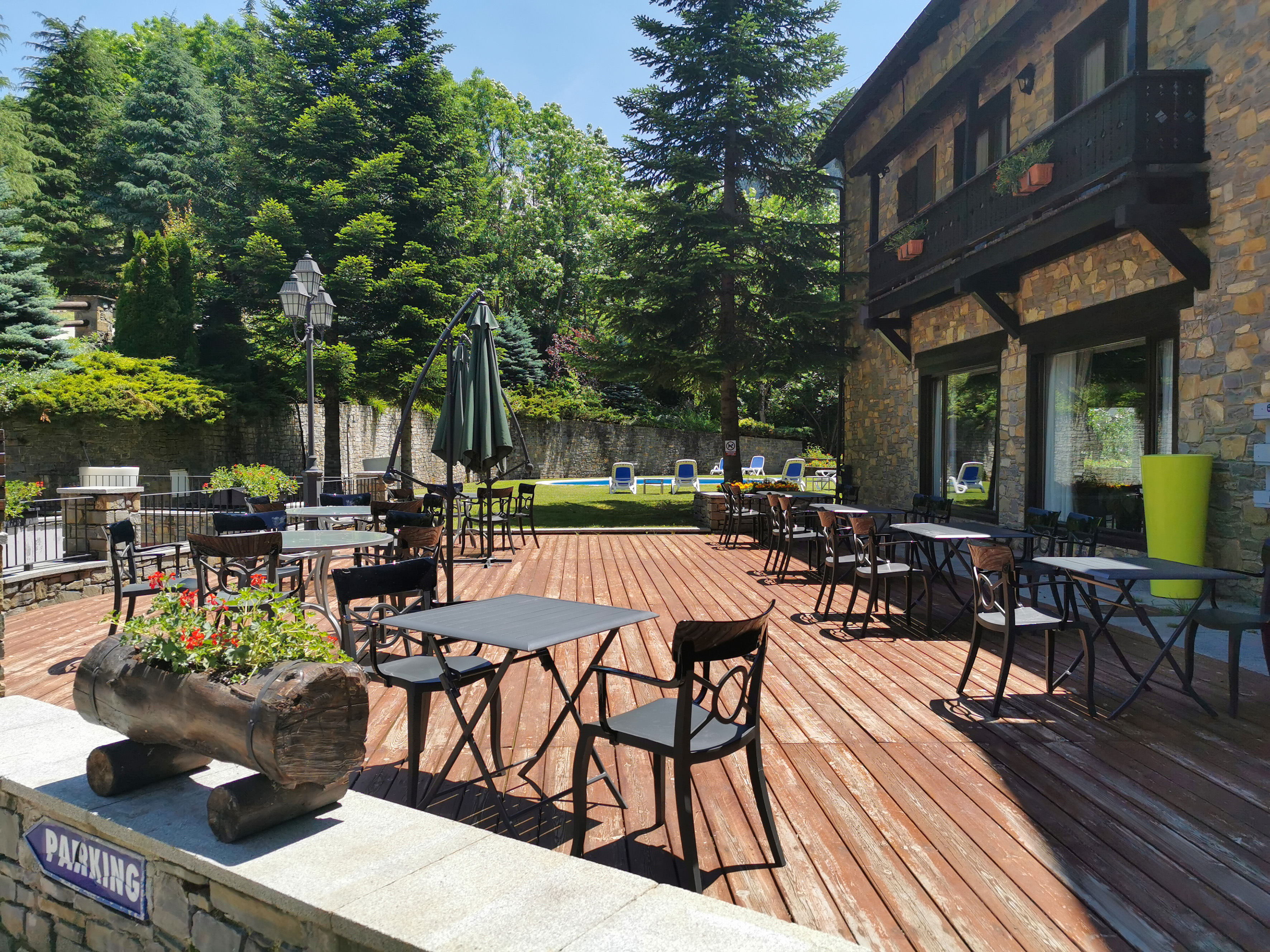 a patio with tables and chairs