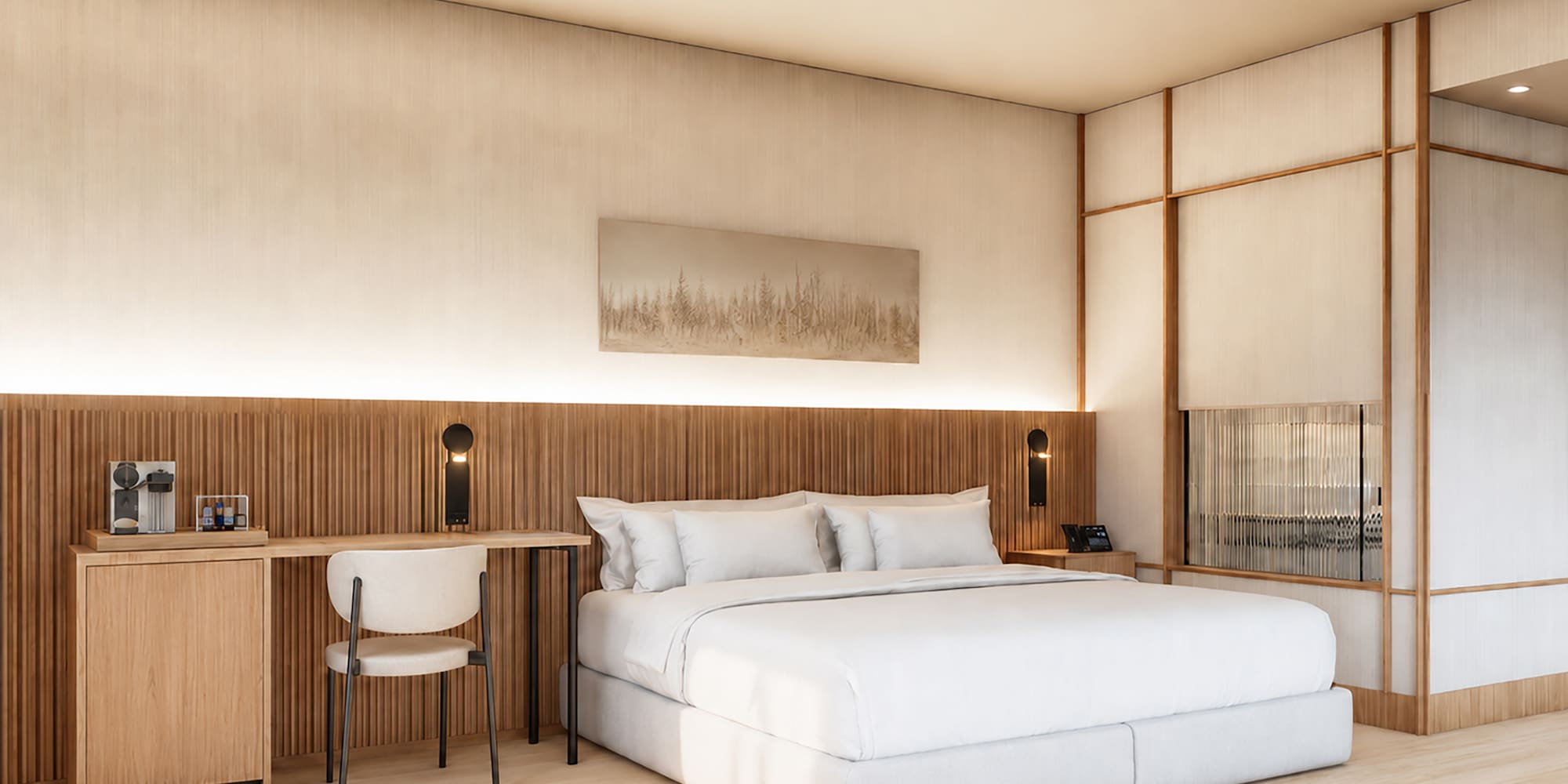 Habitación hotel moderna: cama, escritorio, cabecero y acabados en madera clara.