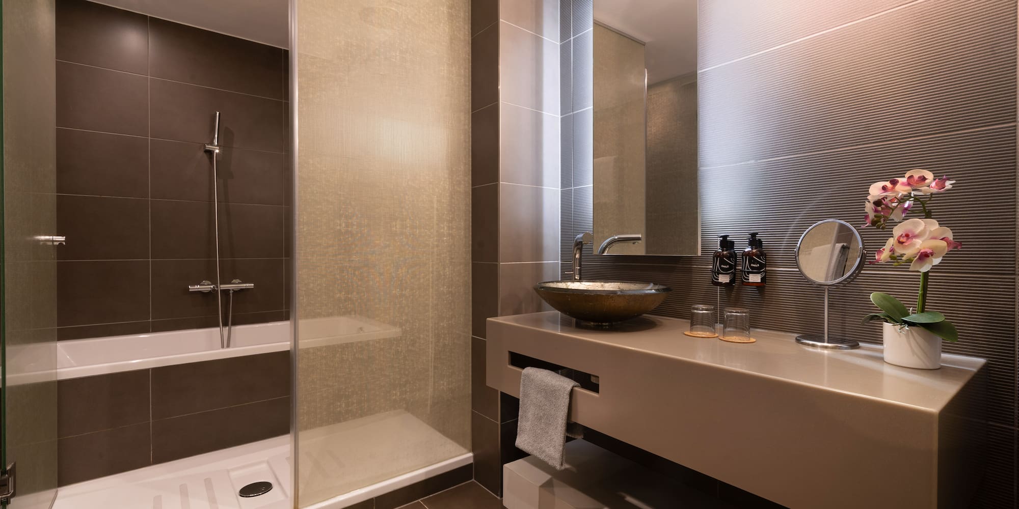 a bathroom with a sink and shower