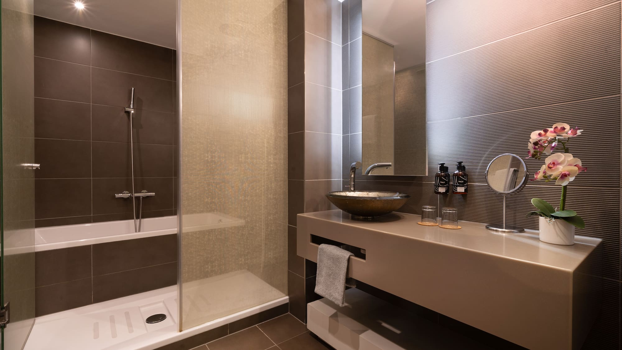 a bathroom with a sink and shower