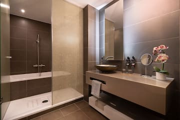 a bathroom with a sink and shower