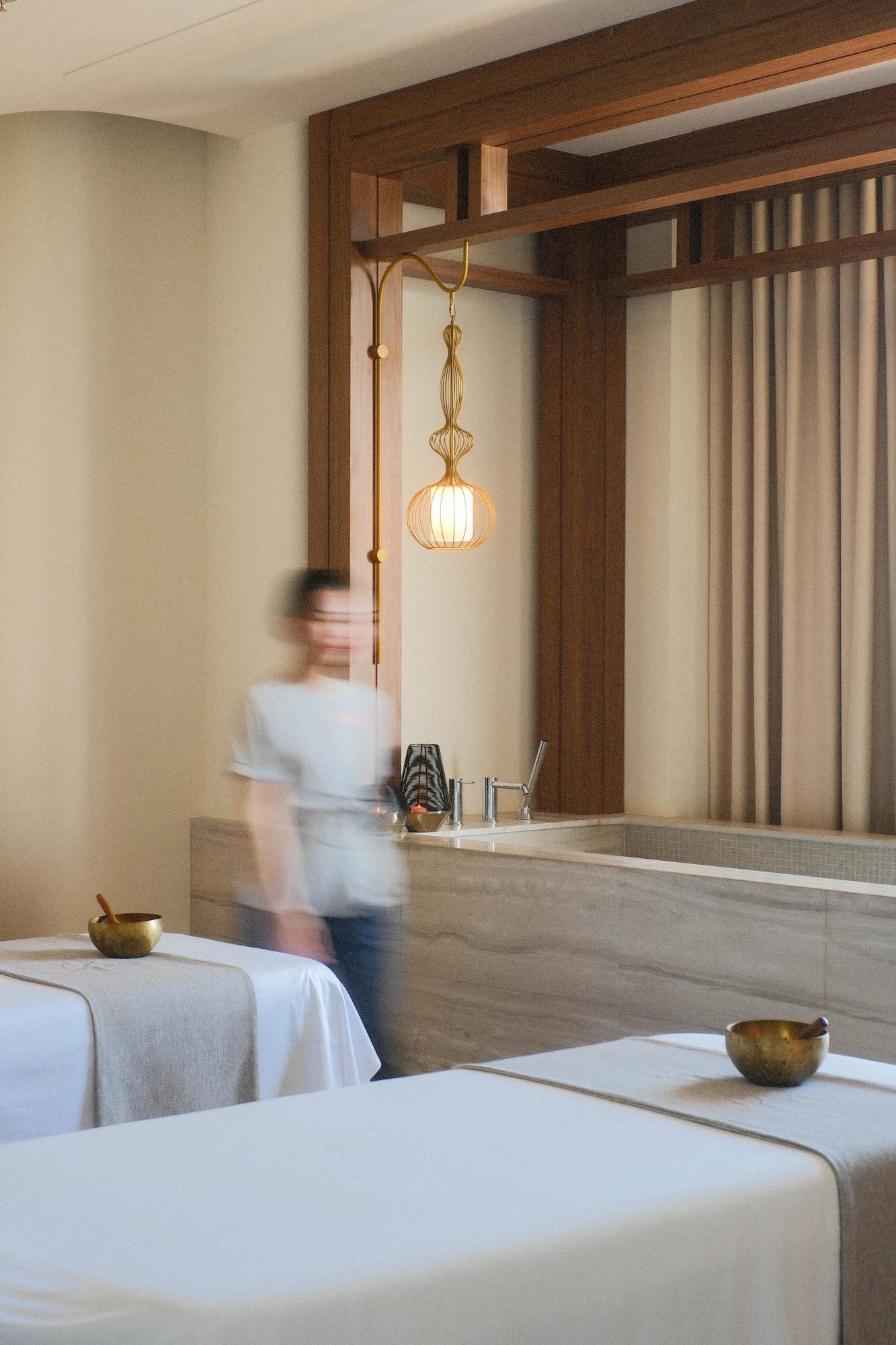 a blurry image of a person walking in a room