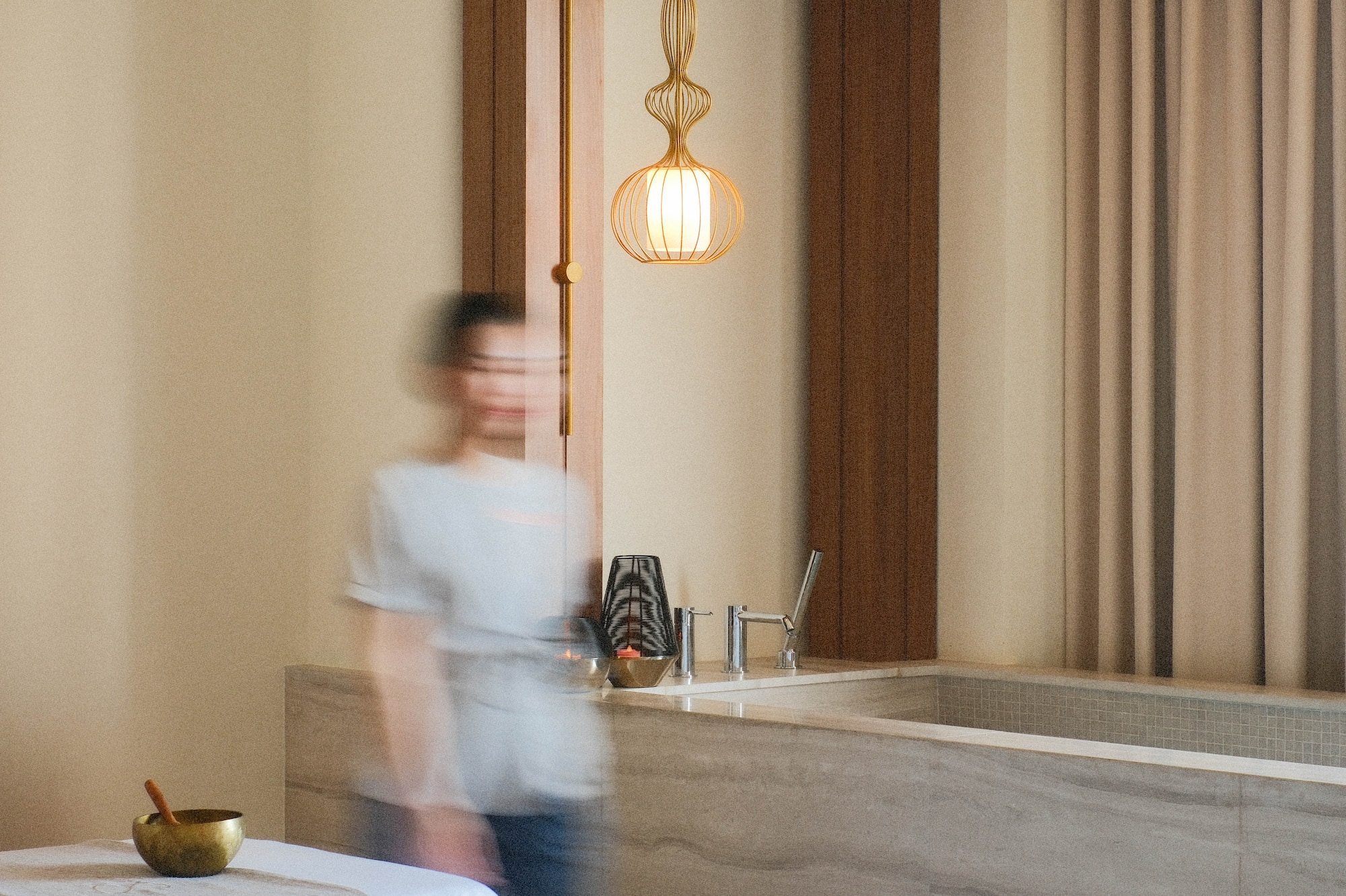 a blurry image of a person walking in a room