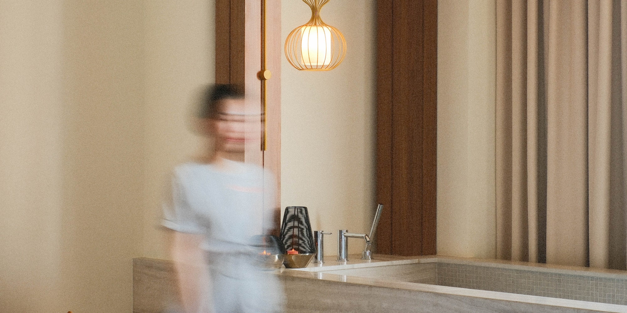 a blurry image of a person walking in a room