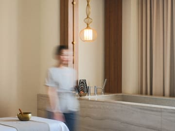 a blurry image of a person walking in a room