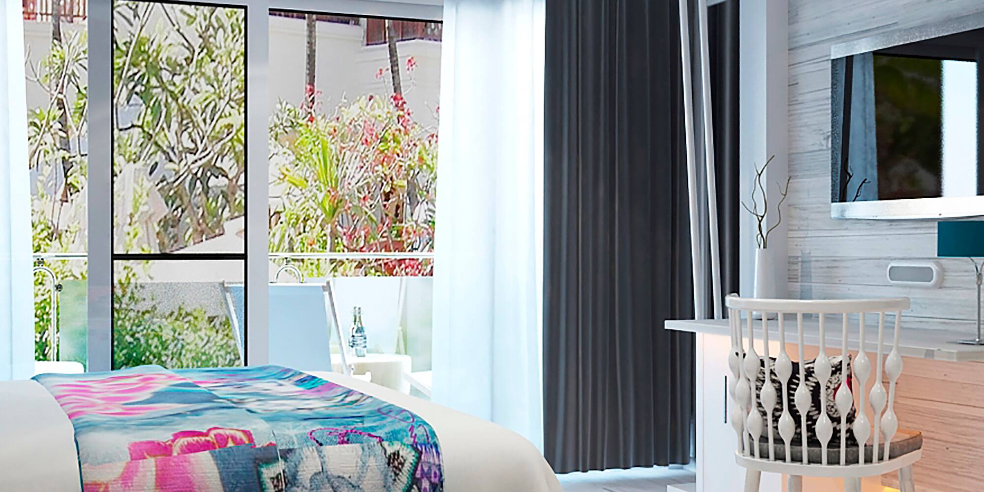 a bedroom with a bed and a television