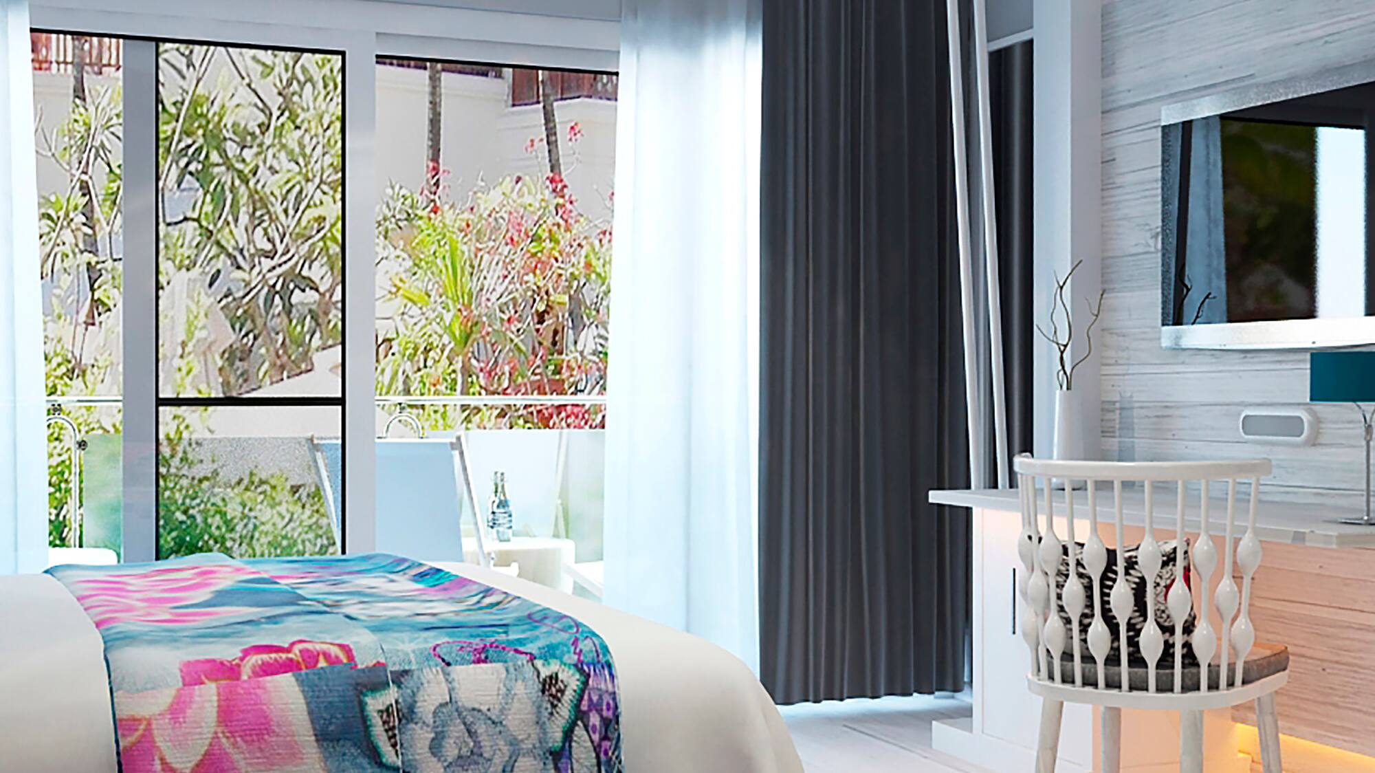 a bedroom with a bed and a television