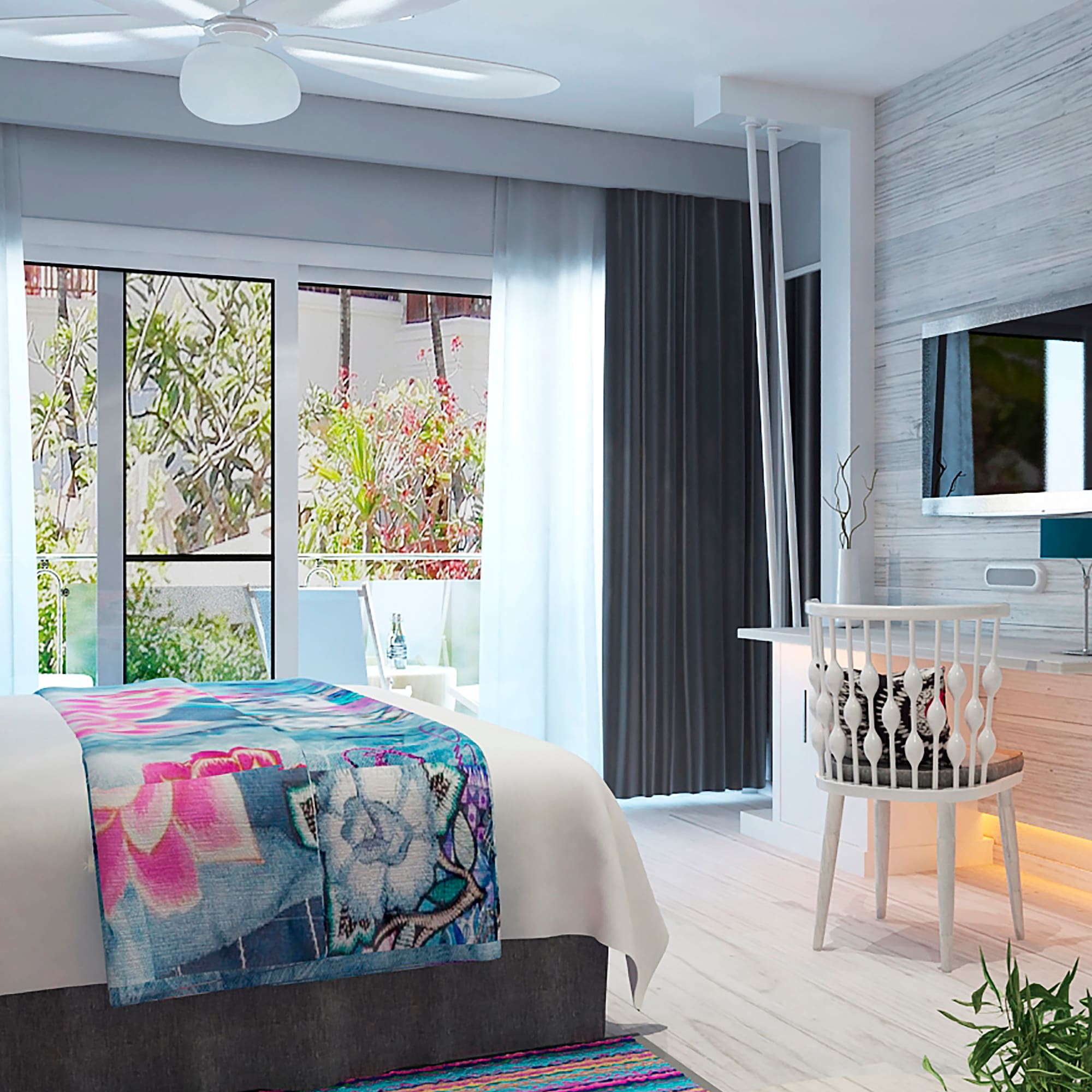 a bedroom with a bed and a television