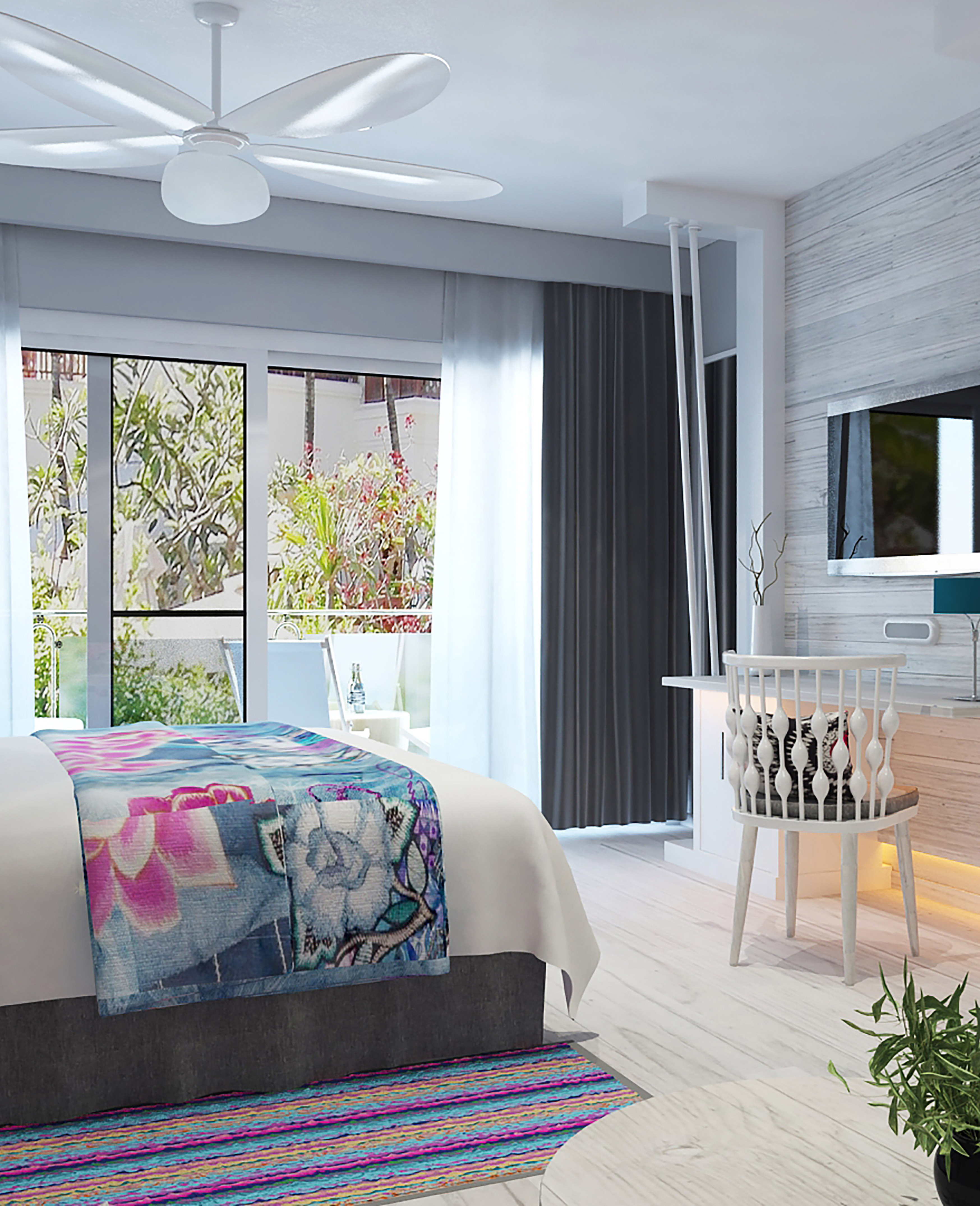 a bedroom with a bed and a television