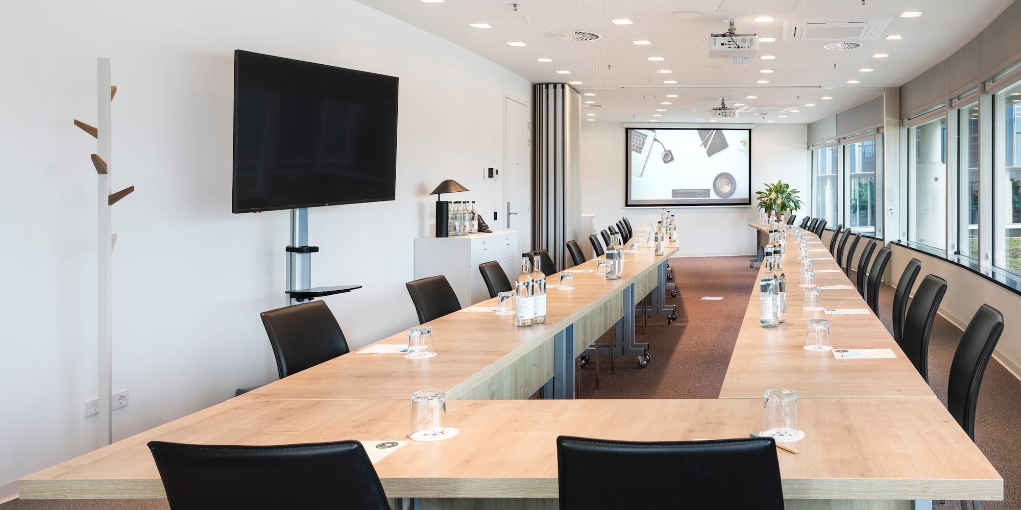 a room with a large table and chairs