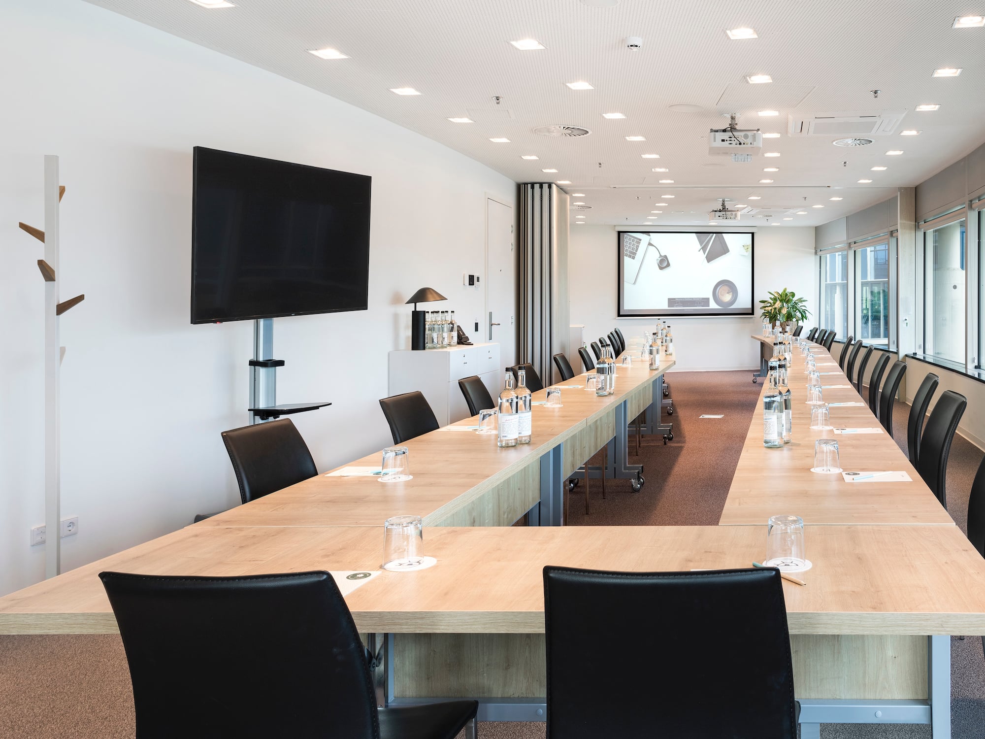 a room with a large table and chairs