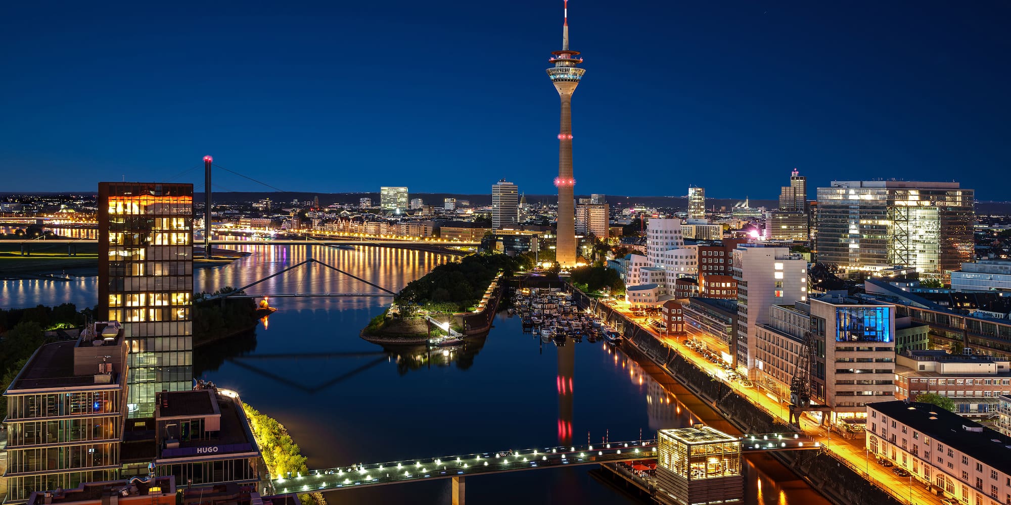 a city with a bridge and a river