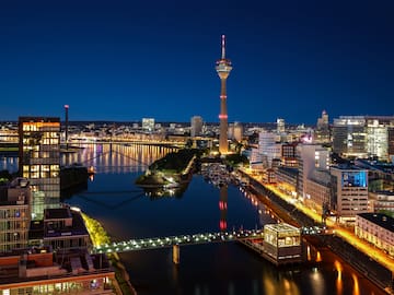 a city with a bridge and a river