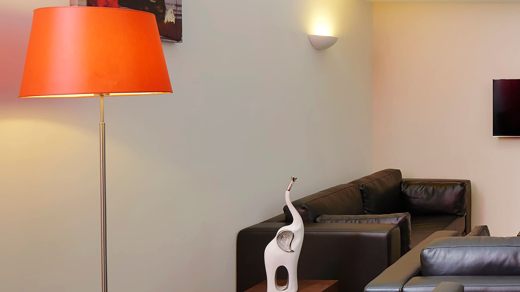 a room with a table and a lamp